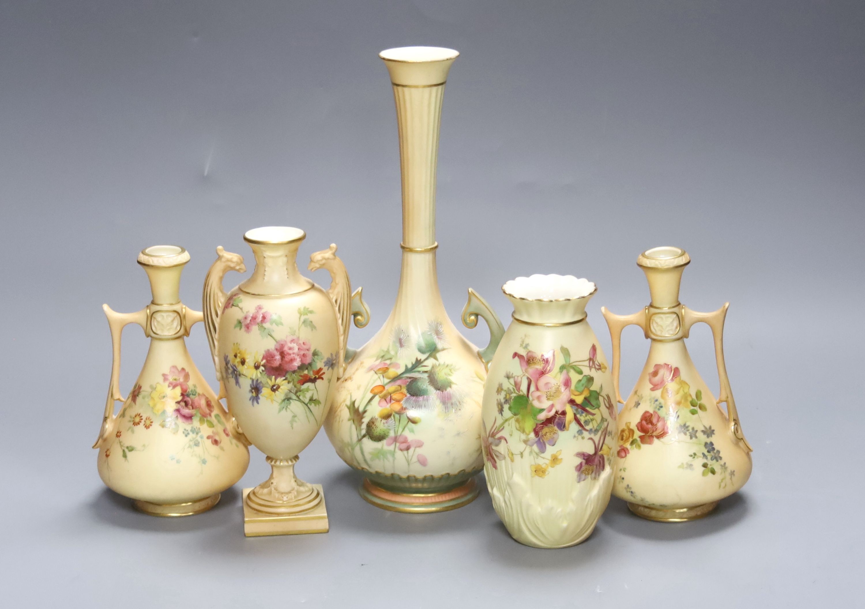 A group of Royal Worcester blush ivory - a pair of vases, and three other vases, 25cm